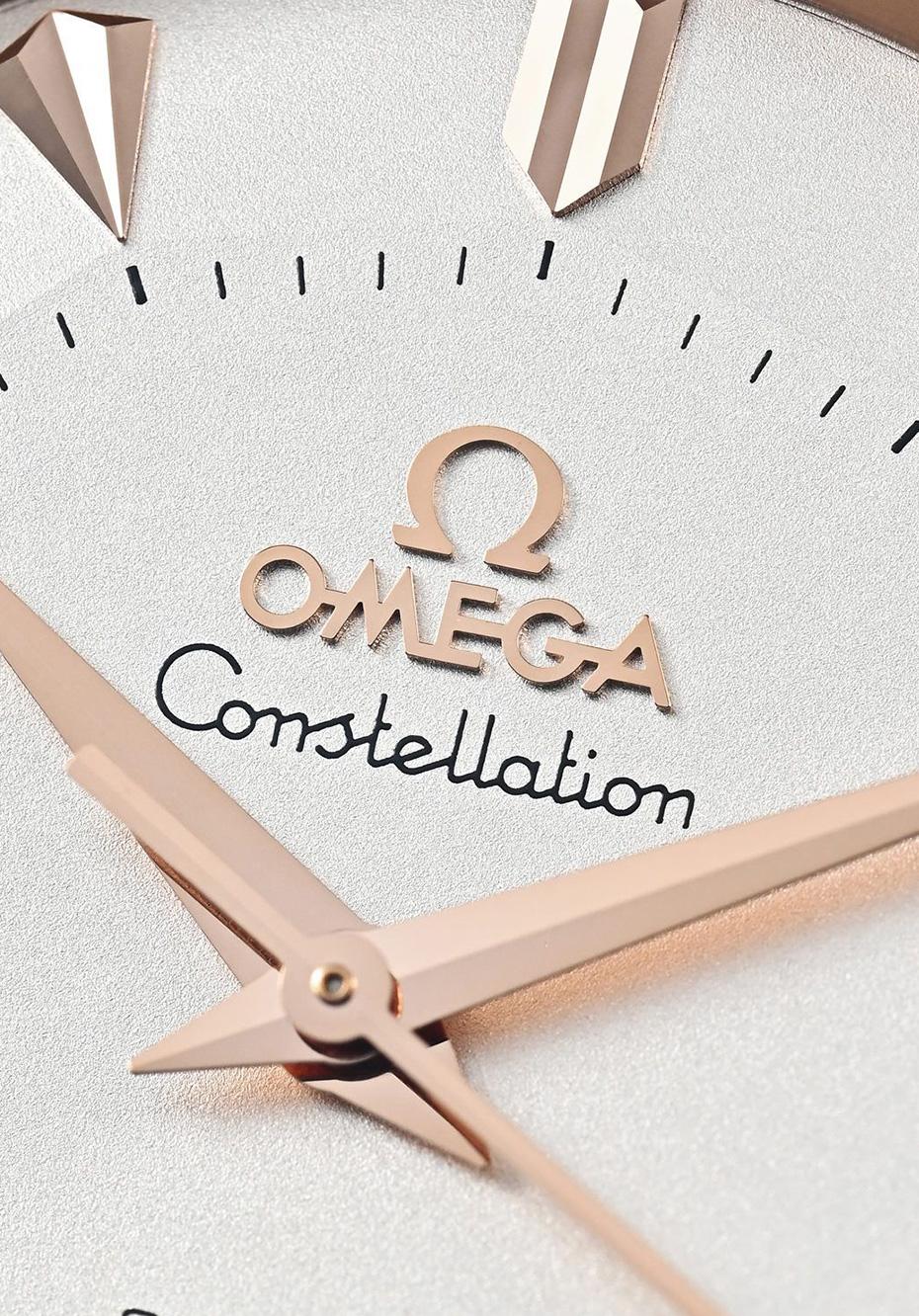 Omega’s Constellation has long been the maison’s signature of sensual elegance. The 38mm rose gold case retains the iconic claws gripping the bezel, while polished edges play with light against a refined brown alligator strap.