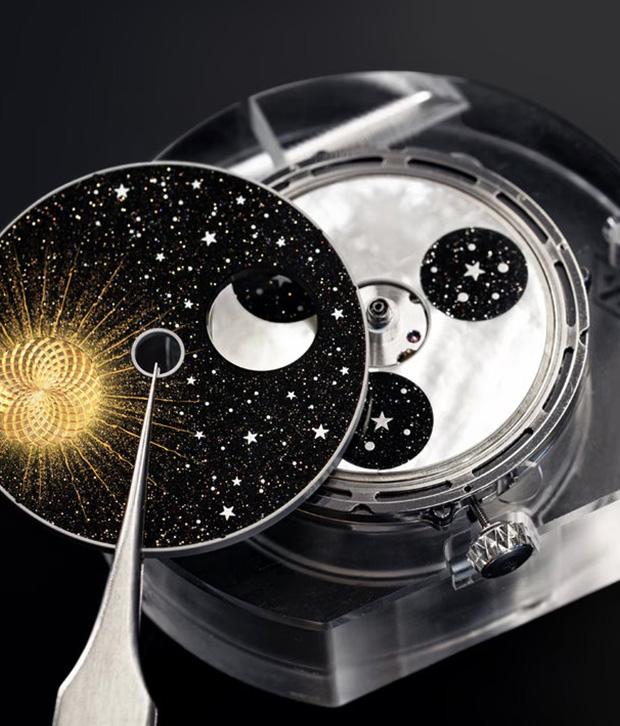 The Midnight Jour Nuit Phase de Lune uses a rotating 24-hour disc to guide the sun and moon across a black aventurine dial, featuring a \"moment on demand\" complication that triggers a full rotation at the wearer\'s desire.