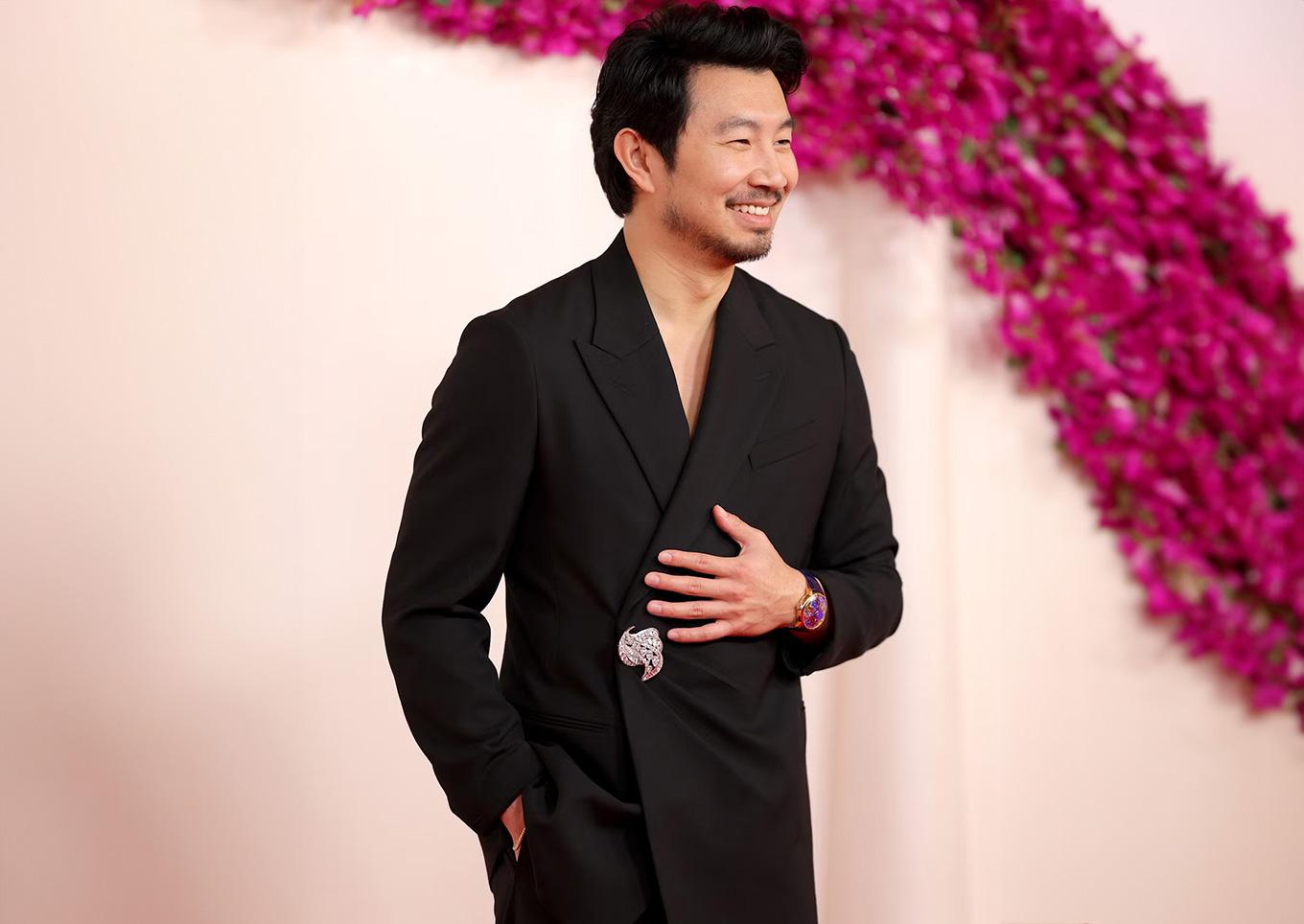 Simu Liu in Jacob & Co.\'s \"The World Is Yours\" Dual Time Zone timepiece