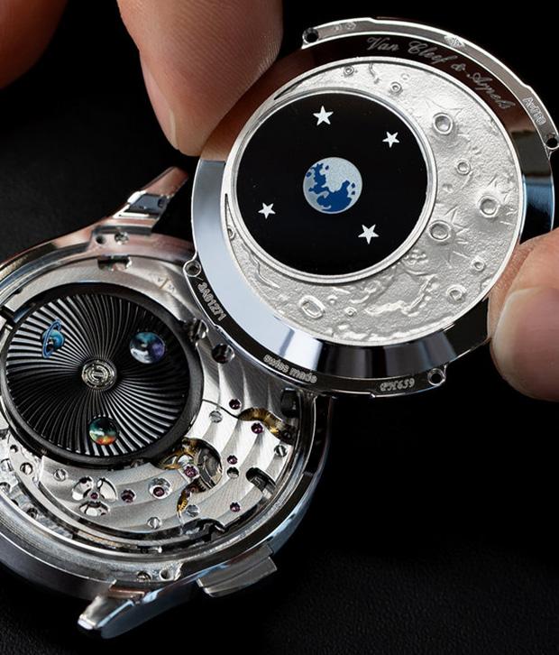 The Midnight Jour Nuit Phase de Lune uses a rotating 24-hour disc to guide the sun and moon across a black aventurine dial, featuring a \"moment on demand\" complication that triggers a full rotation at the wearer\'s desire.