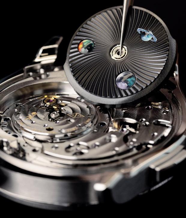 The Midnight Jour Nuit Phase de Lune uses a rotating 24-hour disc to guide the sun and moon across a black aventurine dial, featuring a \"moment on demand\" complication that triggers a full rotation at the wearer\'s desire.