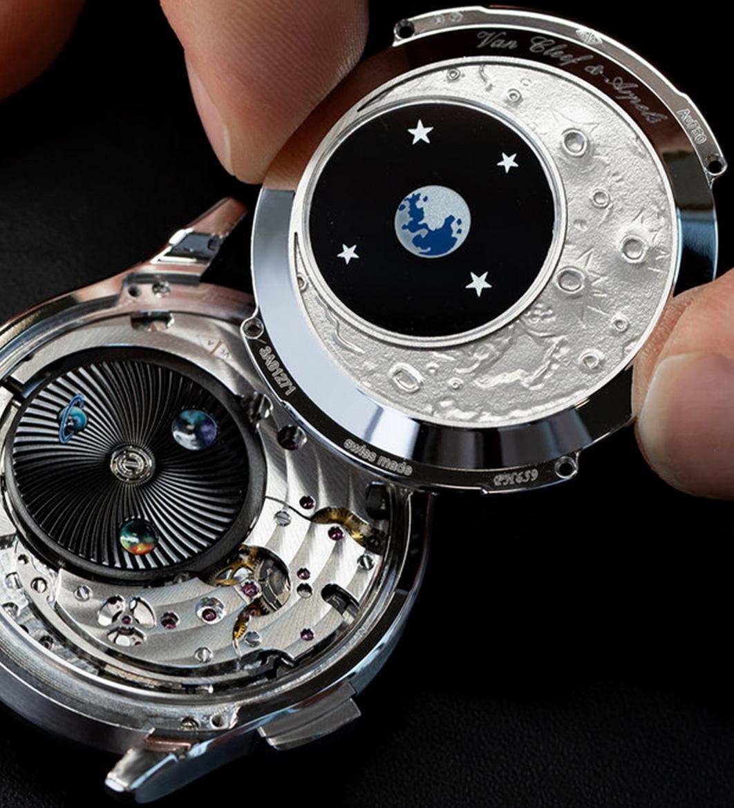 The Midnight Jour Nuit Phase de Lune uses a rotating 24-hour disc to guide the sun and moon across a black aventurine dial, featuring a \"moment on demand\" complication that triggers a full rotation at the wearer\'s desire.