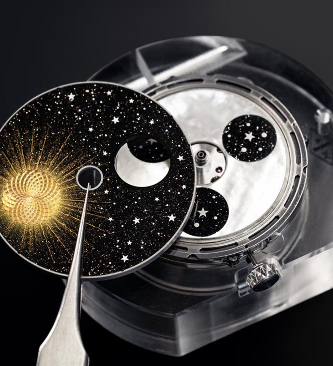 The Midnight Jour Nuit Phase de Lune uses a rotating 24-hour disc to guide the sun and moon across a black aventurine dial, featuring a \"moment on demand\" complication that triggers a full rotation at the wearer\'s desire.
